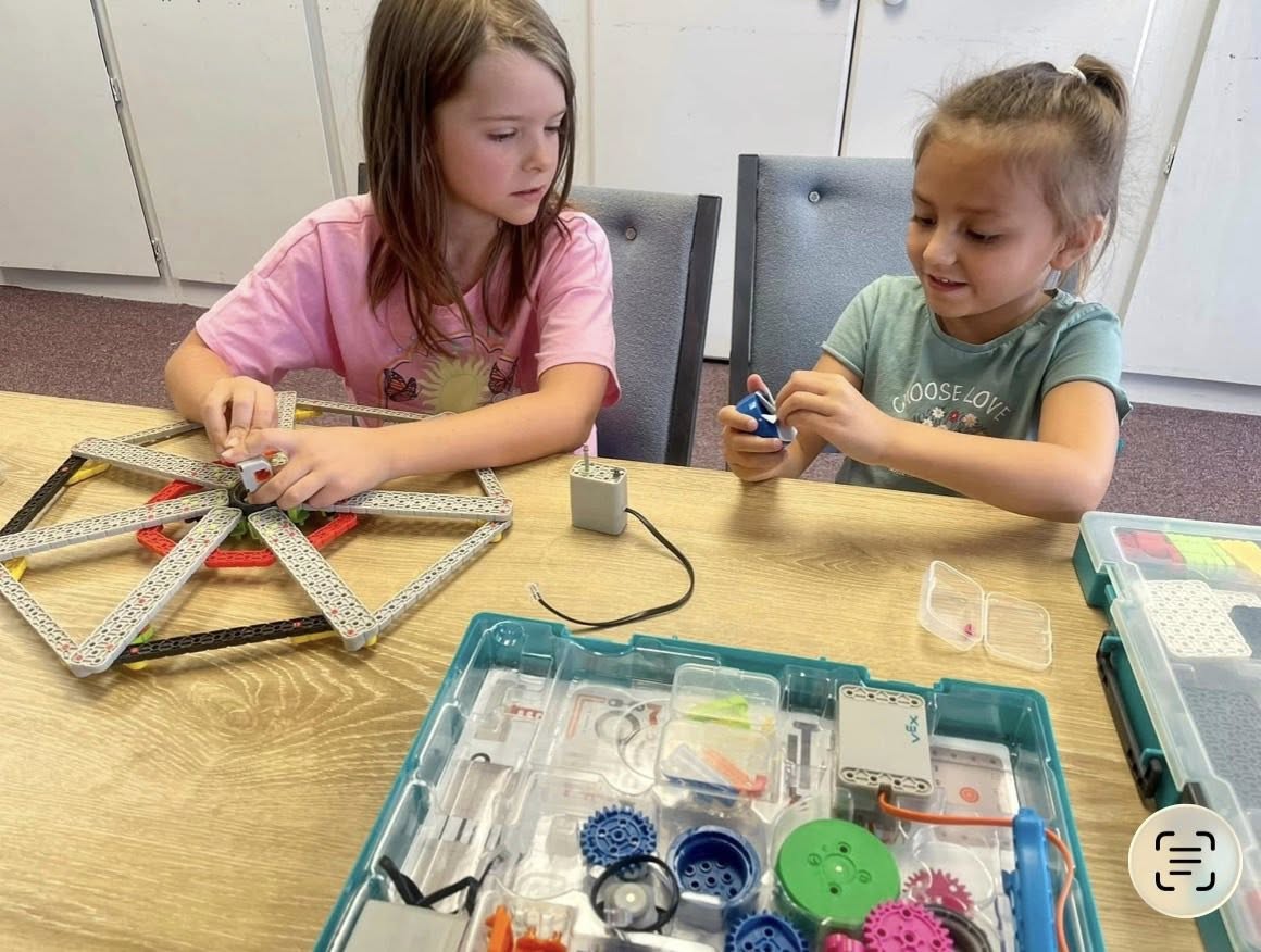 Students building robots with VEX kits