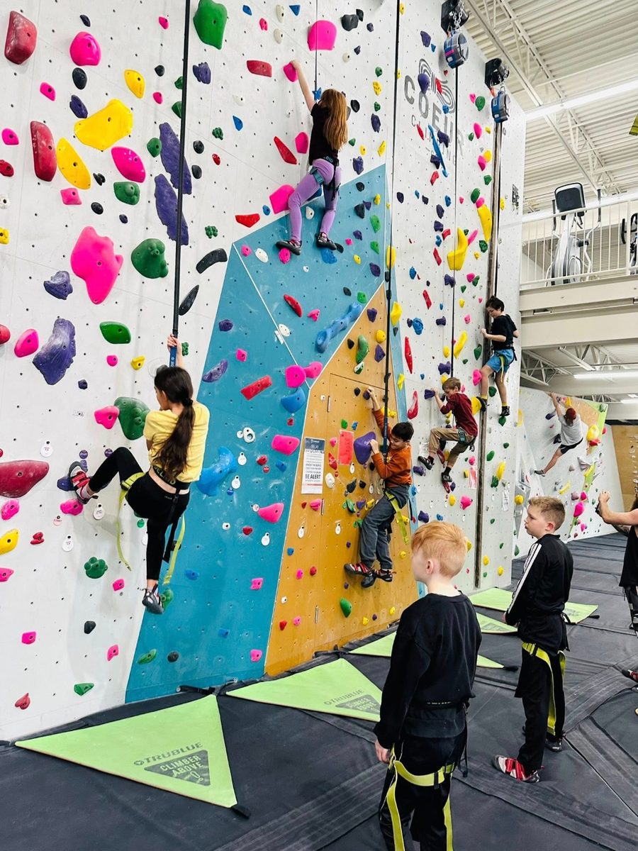 River Tech students climbing at a bouldering gym on a field trip