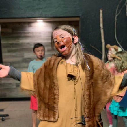 River Tech students performing in a musical on stage