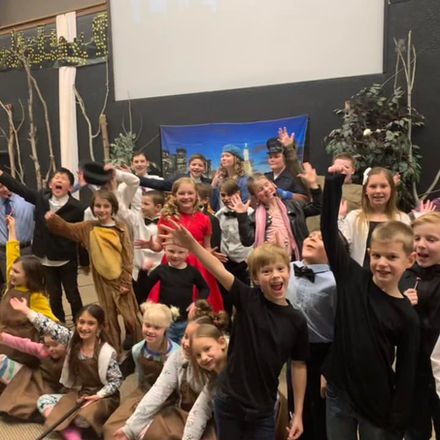 Cast members posing together after a River Tech musical performance